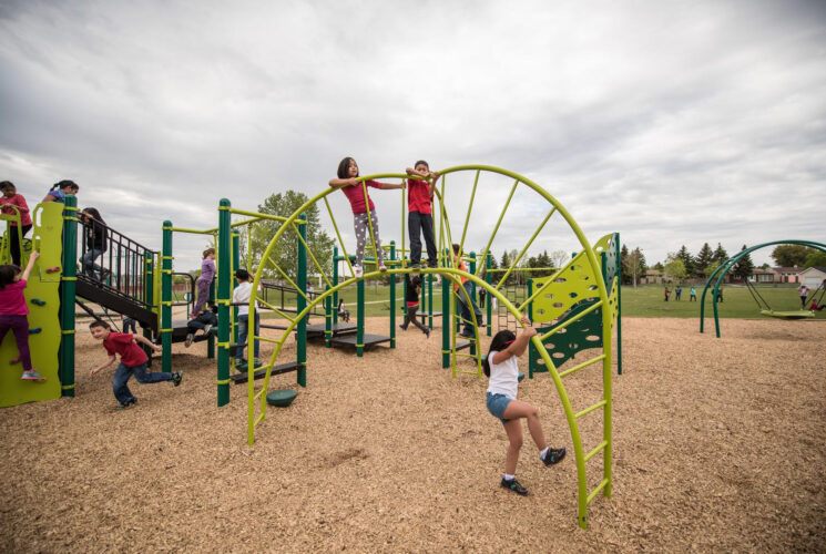 Bunch of kids playing on climber