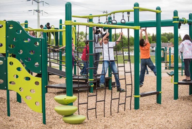 Kids on climbing rope wall