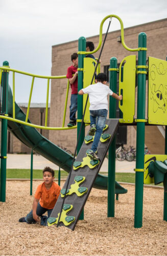 Kids climbing on playground equipment.