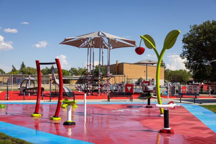 Splash pad equipment on red and blue surfacing.