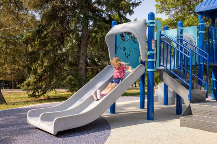 Kid going down slide