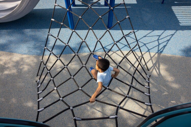 Kid climbing on net