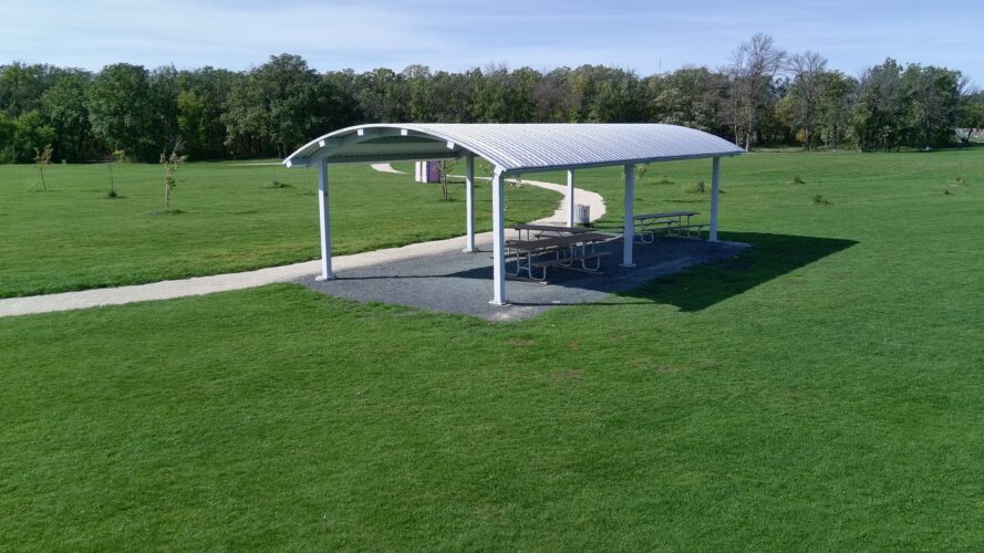 La Barriere Park Cricket Field shelter providing shade to picnic tables.