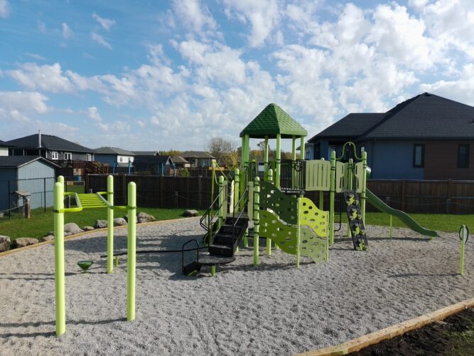 Bright green monkey bars and playground structure.