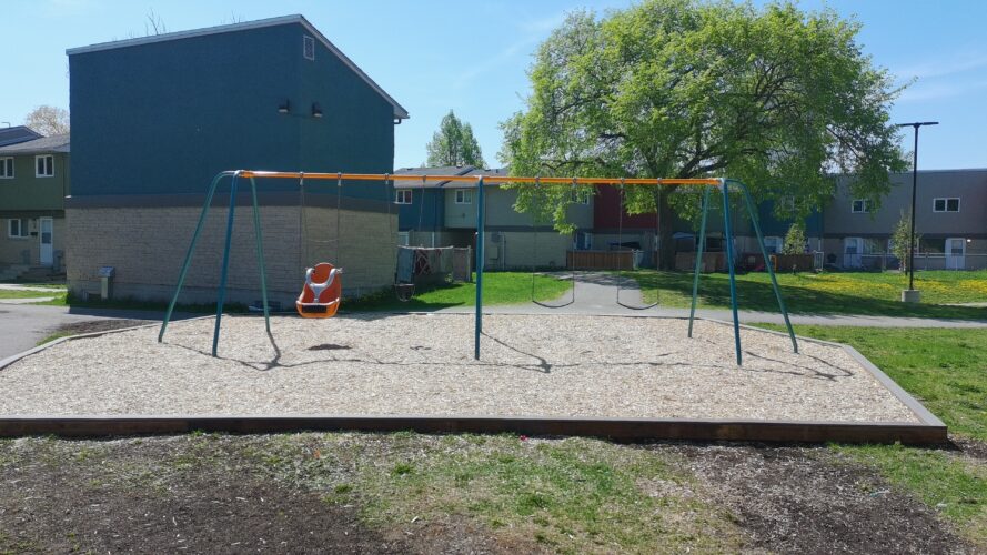 Swing set at Manitoba Housing Complex.