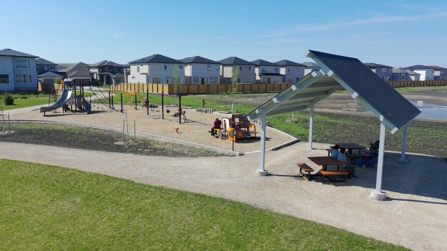 Playground featuring a slides, climbers, swings and a shelter at Firestone Park