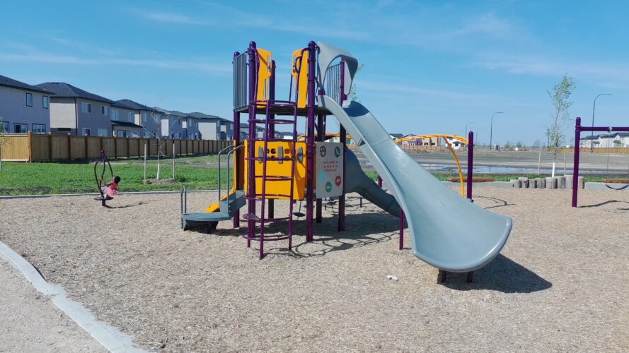 PlayBooster play structure featuring slides and climbers at Firestone Park